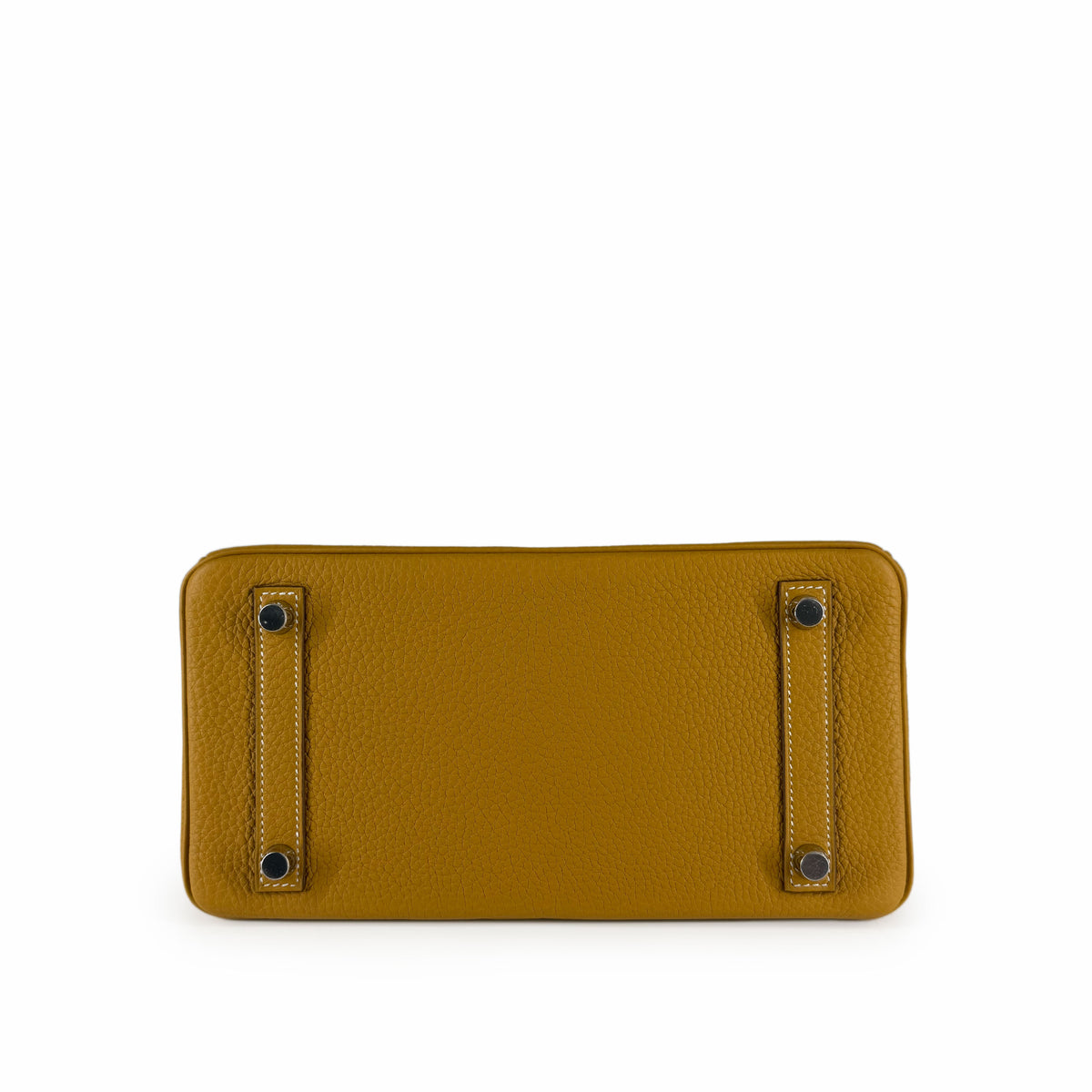 Mustard yellow grained leather handbag base with protective metal feet, curated Pre-loved Luxury by Myluxe in Helsinki.