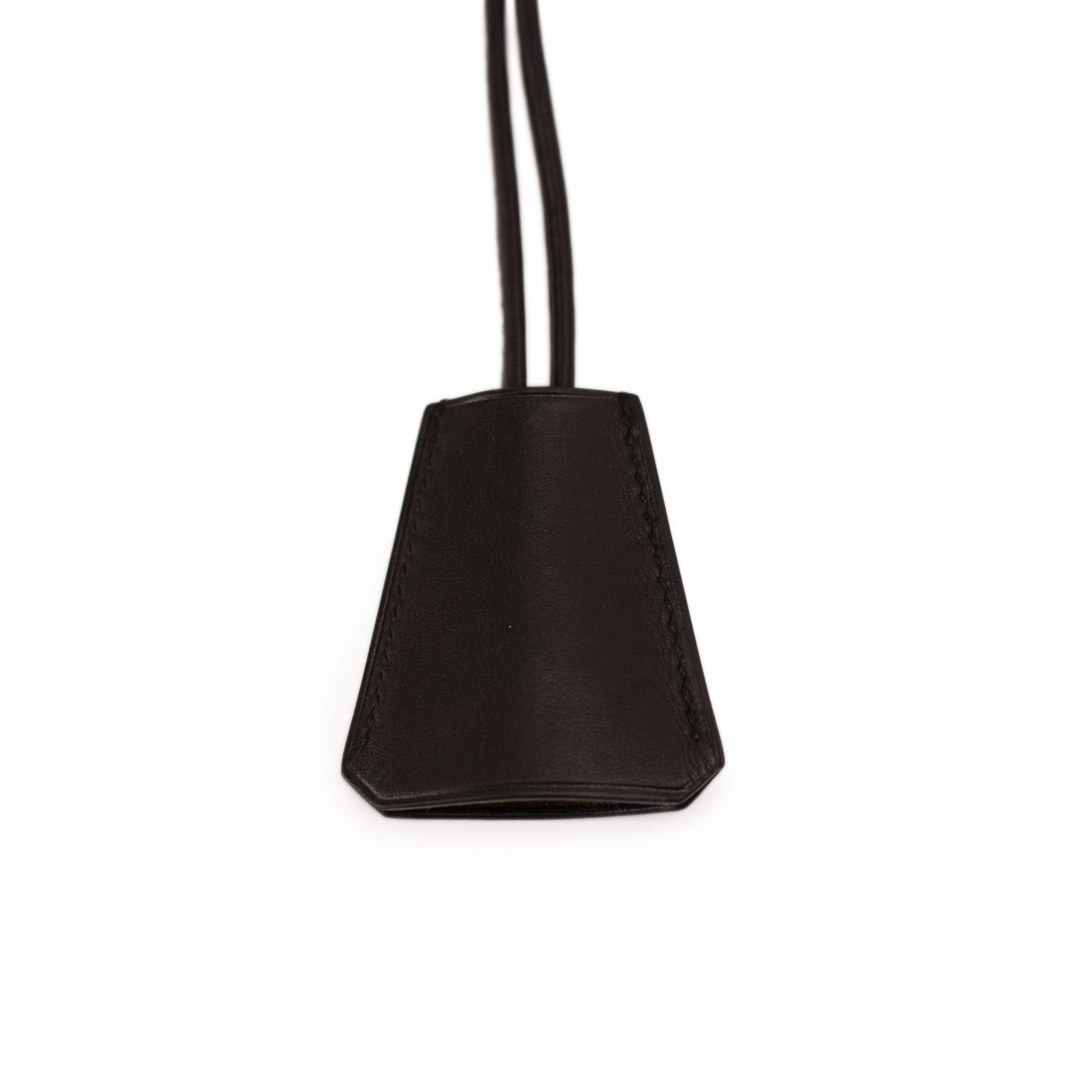 Black leather luxury accessory charm. curated Pre-loved Luxury by Myluxe in Helsinki.