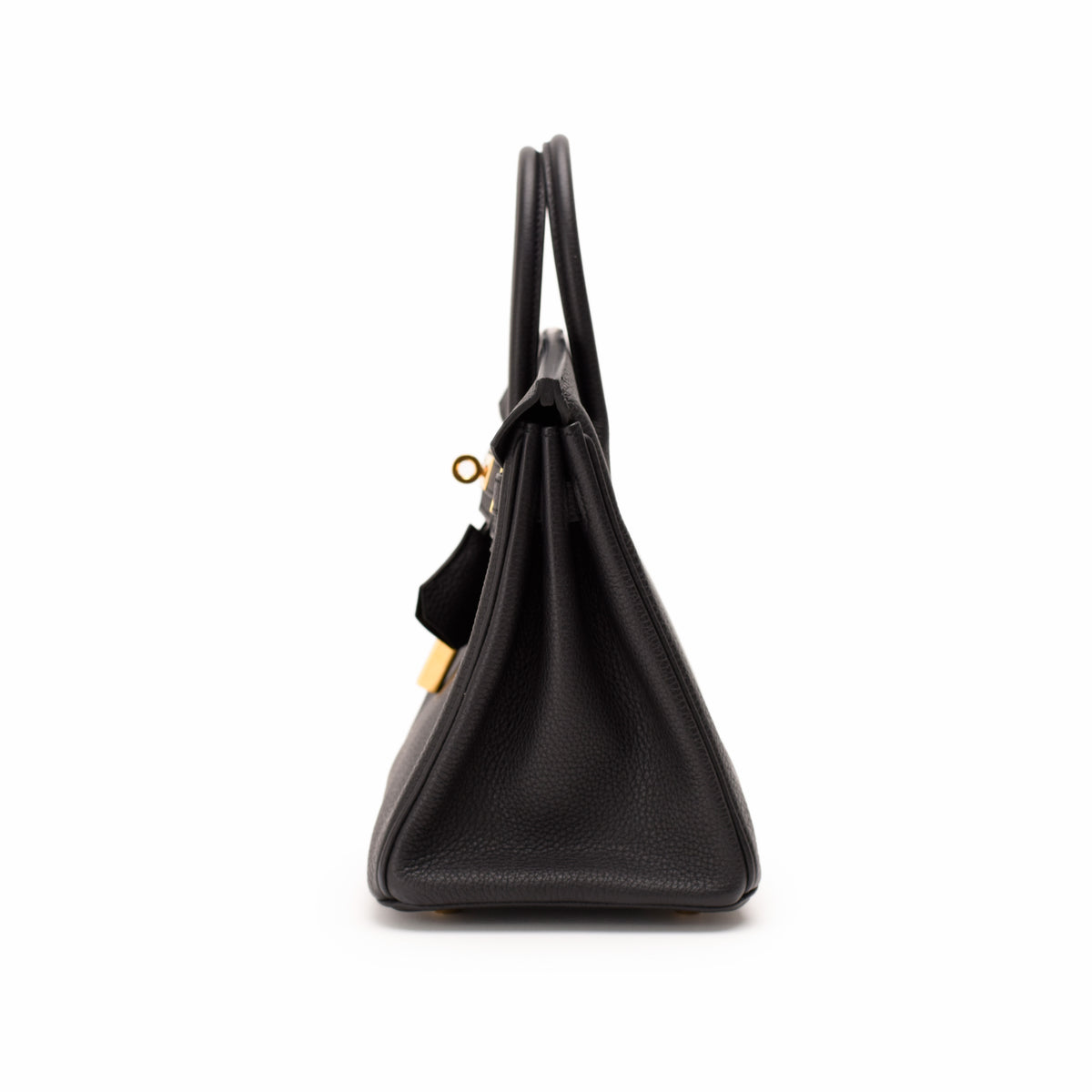 Black pebbled leather top handle handbag with gold-tone hardware, curated Pre-loved Luxury by Myluxe in Helsinki.