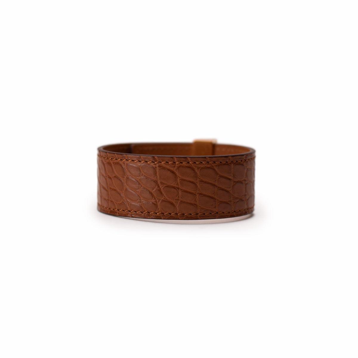 Brown crocodile-embossed leather cuff bracelet. Curated Pre-loved Luxury by Myluxe in Helsinki.