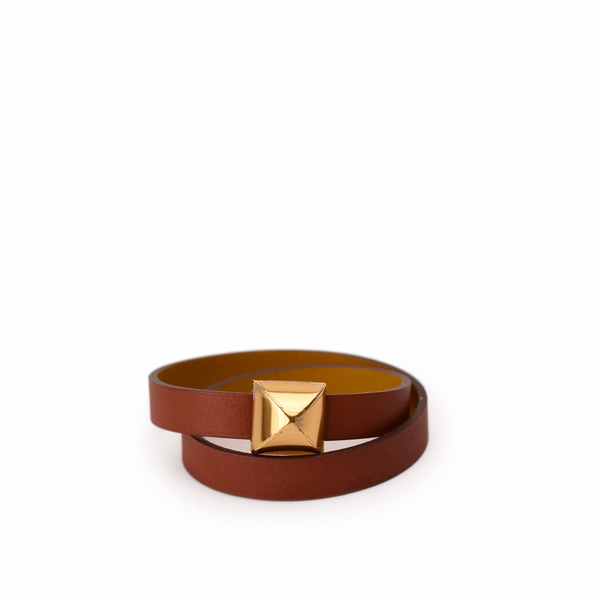 Brown leather belt with a geometric gold-tone pyramid buckle. curated Pre-loved Luxury by Myluxe in Helsinki.