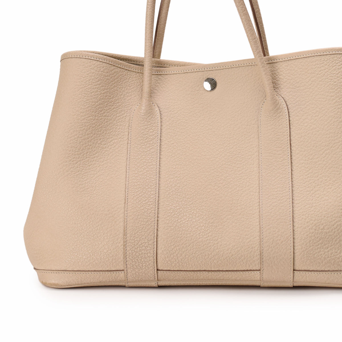 Beige pebbled leather tote bag with dual shoulder handles. curated Pre-loved Luxury by Myluxe in Helsinki.