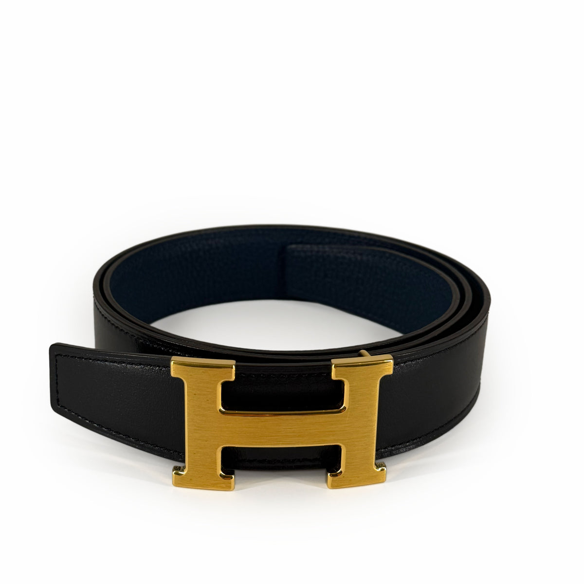 Black leather belt with gold-tone H buckle, curated Pre-loved Luxury by Myluxe in Helsinki.