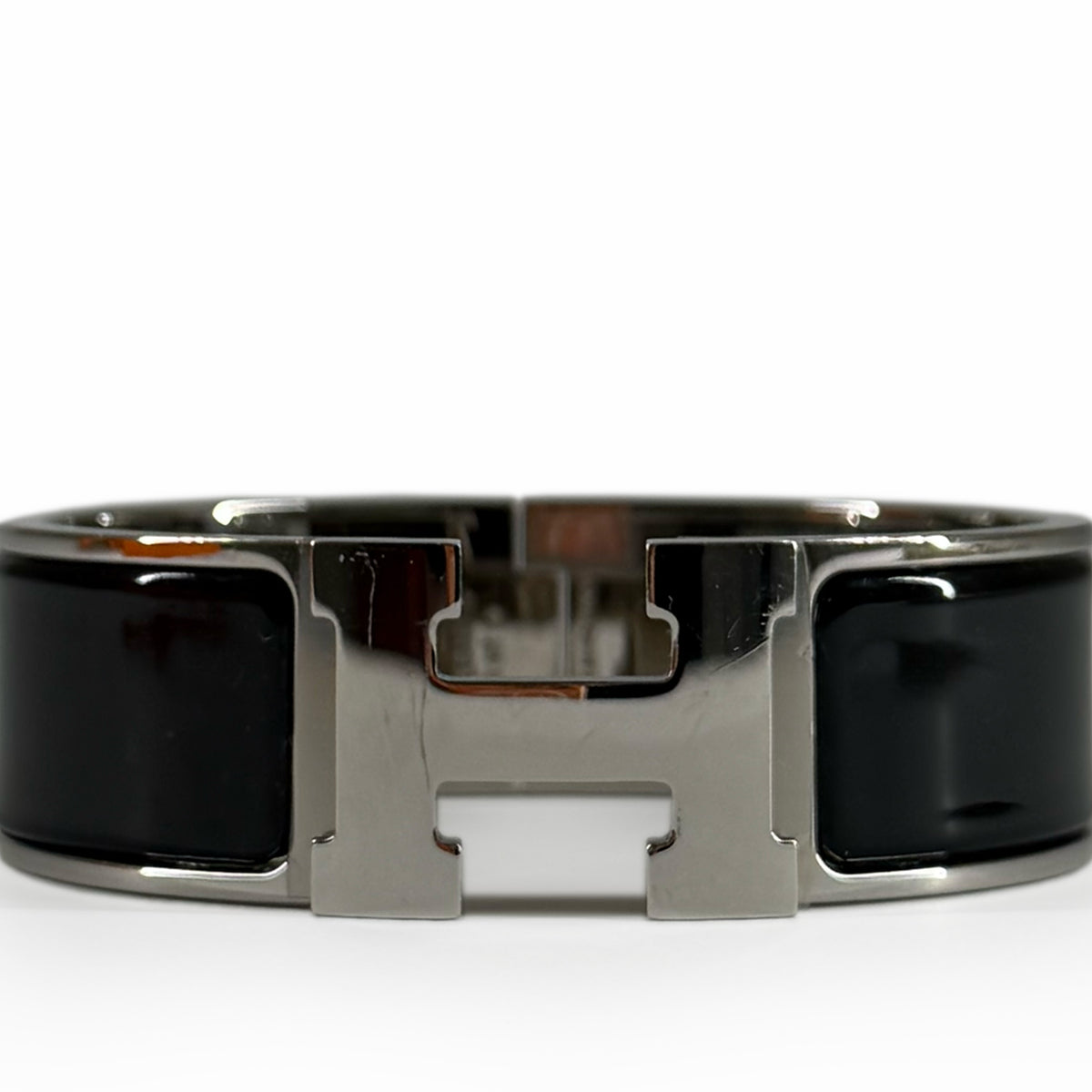 Silver metal and black enamel H-shaped bracelet, curated Pre-loved Luxury by Myluxe in Helsinki.