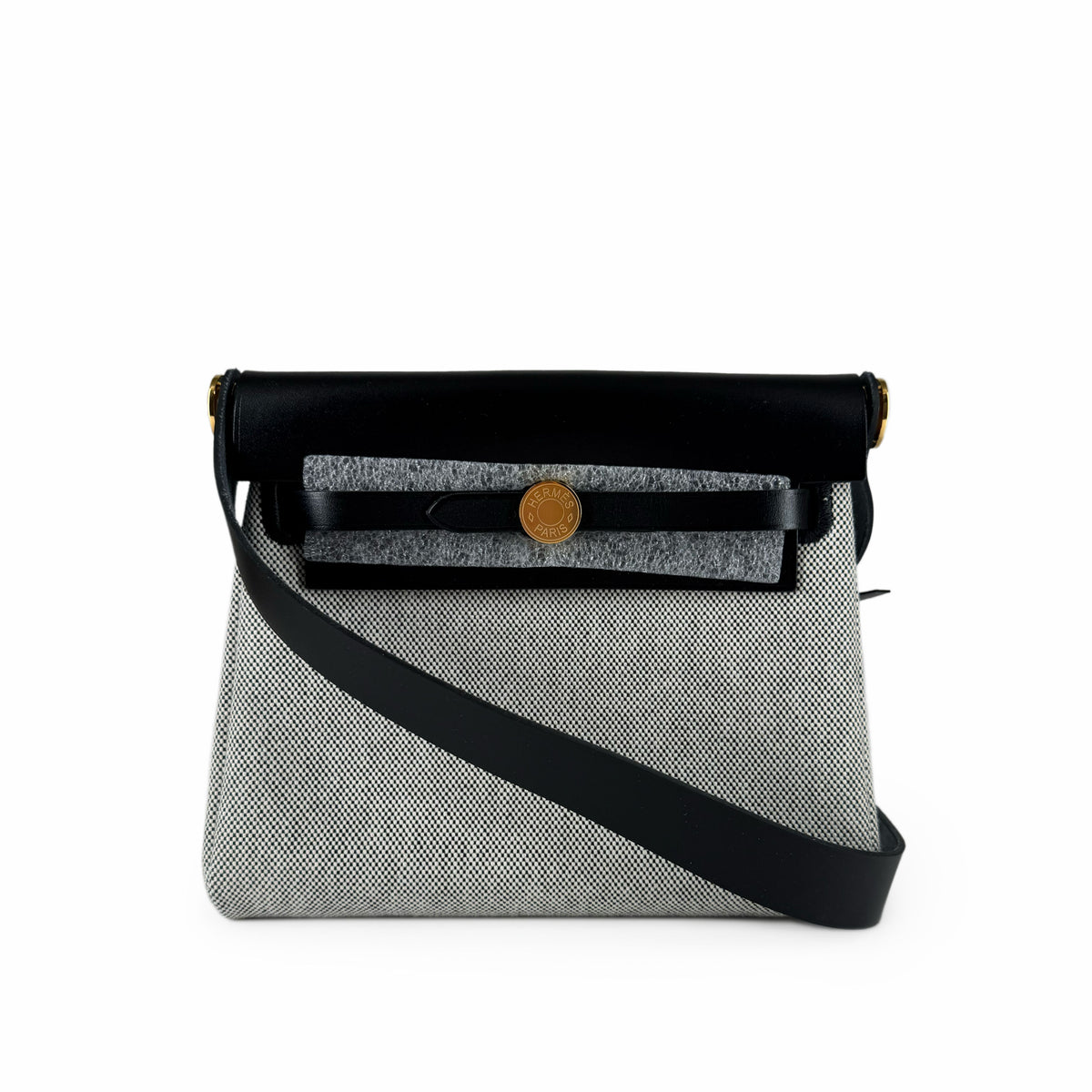 Black and grey textured crossbody bag with leather strap, curated Pre-loved Luxury by Myluxe in Helsinki.