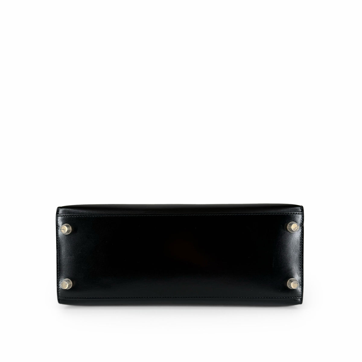 Bottom view of a black leather designer handbag with silver metal protective feet, curated Pre-loved Luxury by Myluxe in Helsinki.
