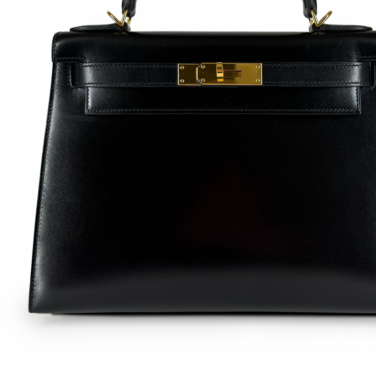 Black smooth leather handbag with gold-tone hardware, curated Pre-loved Luxury by Myluxe in Helsinki.