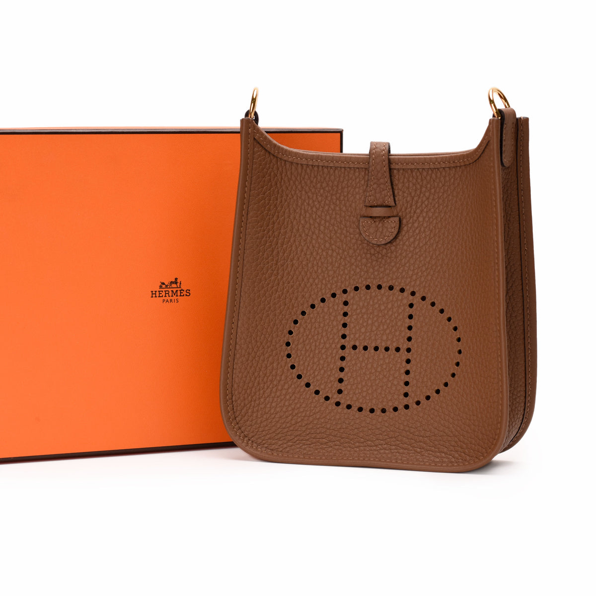 Brown Togo leather Hermès Evelyne bag with perforated H logo, curated Pre-loved Luxury by Myluxe in Helsinki.