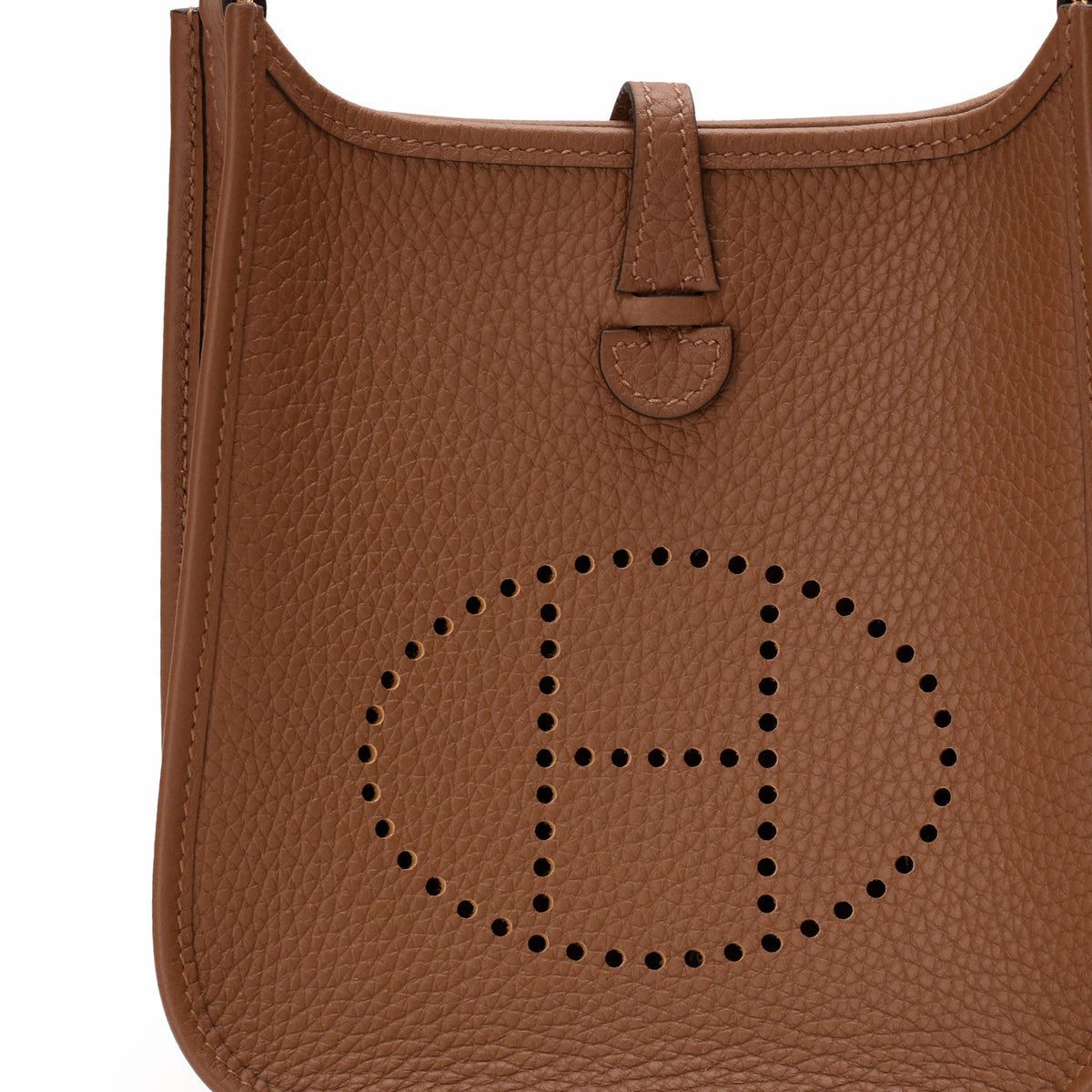 Brown pebbled leather handbag with perforated H logo detail, curated Pre-loved Luxury by Myluxe in Helsinki.