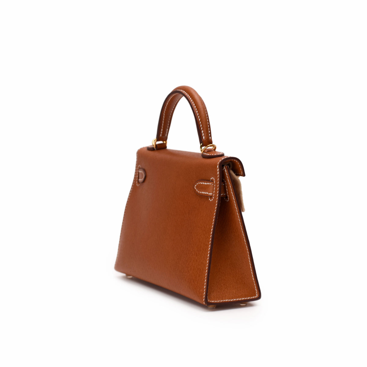 Tan leather top handle handbag with structured design, curated Pre-loved Luxury by Myluxe in Helsinki.