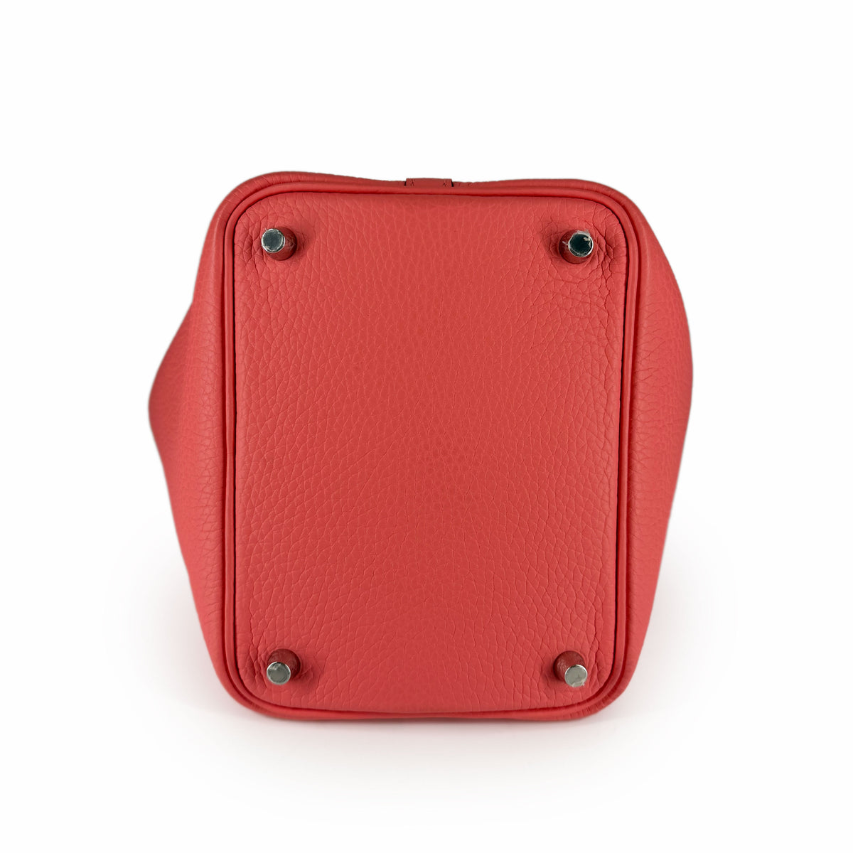 Red pebbled leather handbag base with silver metal feet, curated Pre-loved Luxury by Myluxe in Helsinki.
