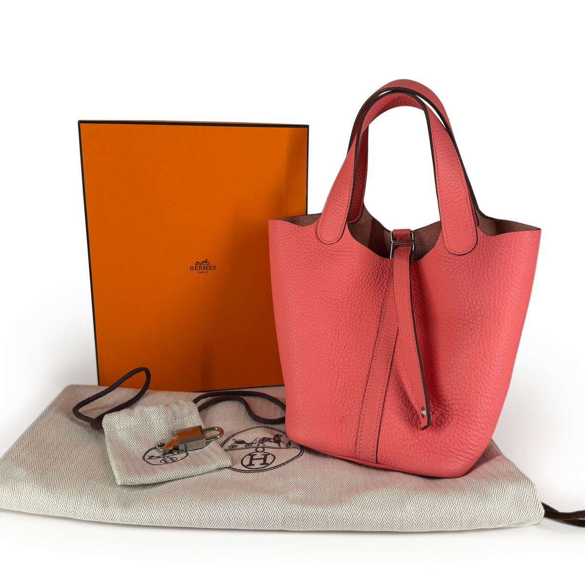 Pink leather Hermès Garden Party tote bag with orange box, curated Pre-loved Luxury by Myluxe in Helsinki.