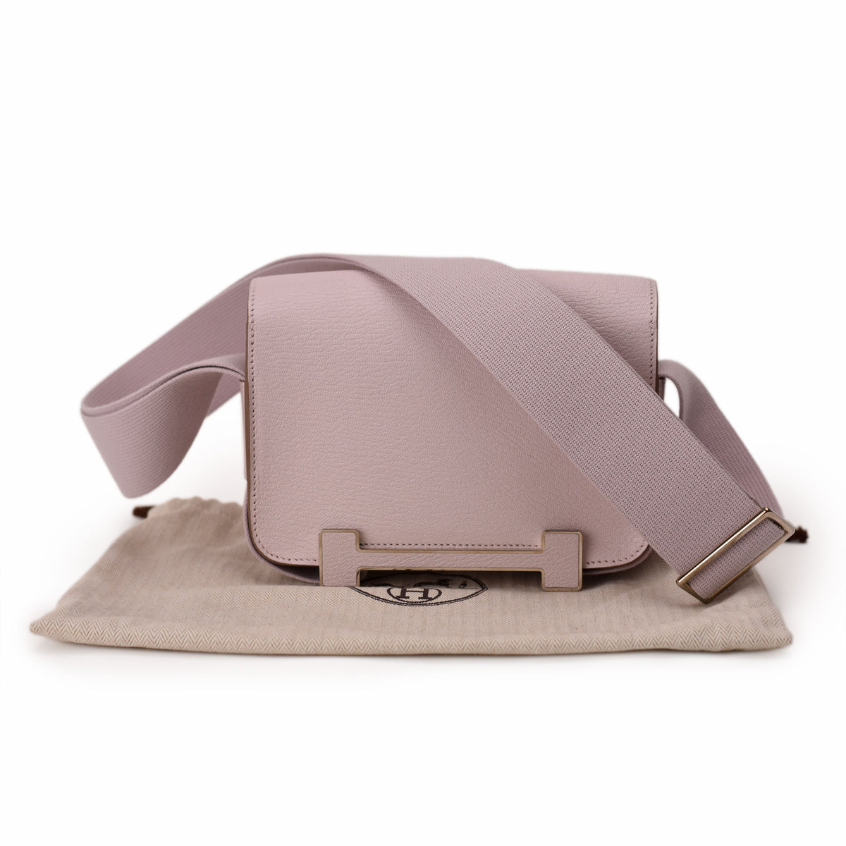 Hermès mauve leather crossbody bag with wide fabric strap. curated Pre-loved Luxury by Myluxe in Helsinki.