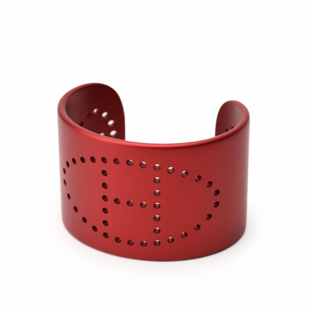 Red matte metal cuff bracelet with perforated H pattern, curated Pre-loved Luxury by Myluxe in Helsinki.
