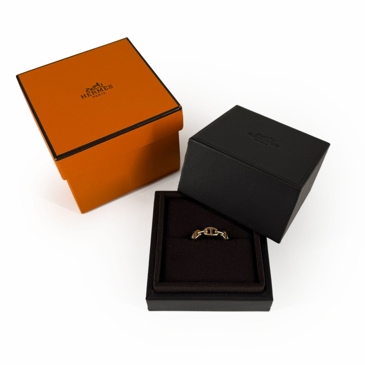 Gold Hermès ring in a black luxury jewelry box, curated Pre-loved Luxury by Myluxe in Helsinki.