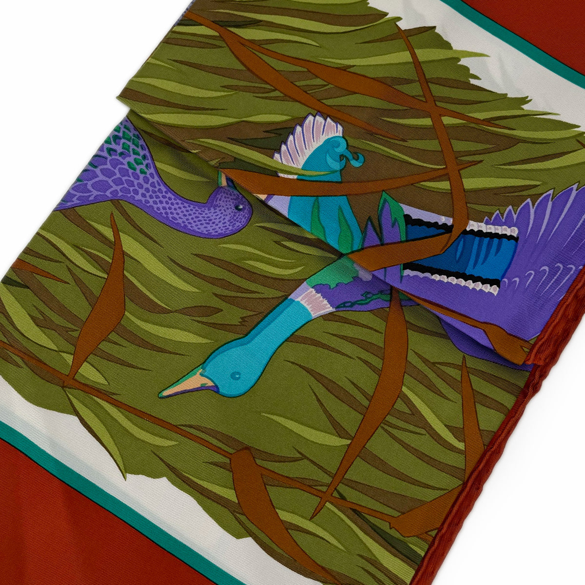Silk scarf with colorful bird and grass pattern in green, blue, and purple. curated Pre-loved Luxury by Myluxe in Helsinki.