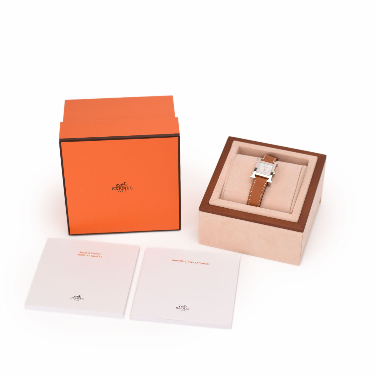 Hermès watch with brown leather strap in signature orange box. curated Pre-loved Luxury by Myluxe in Helsinki.