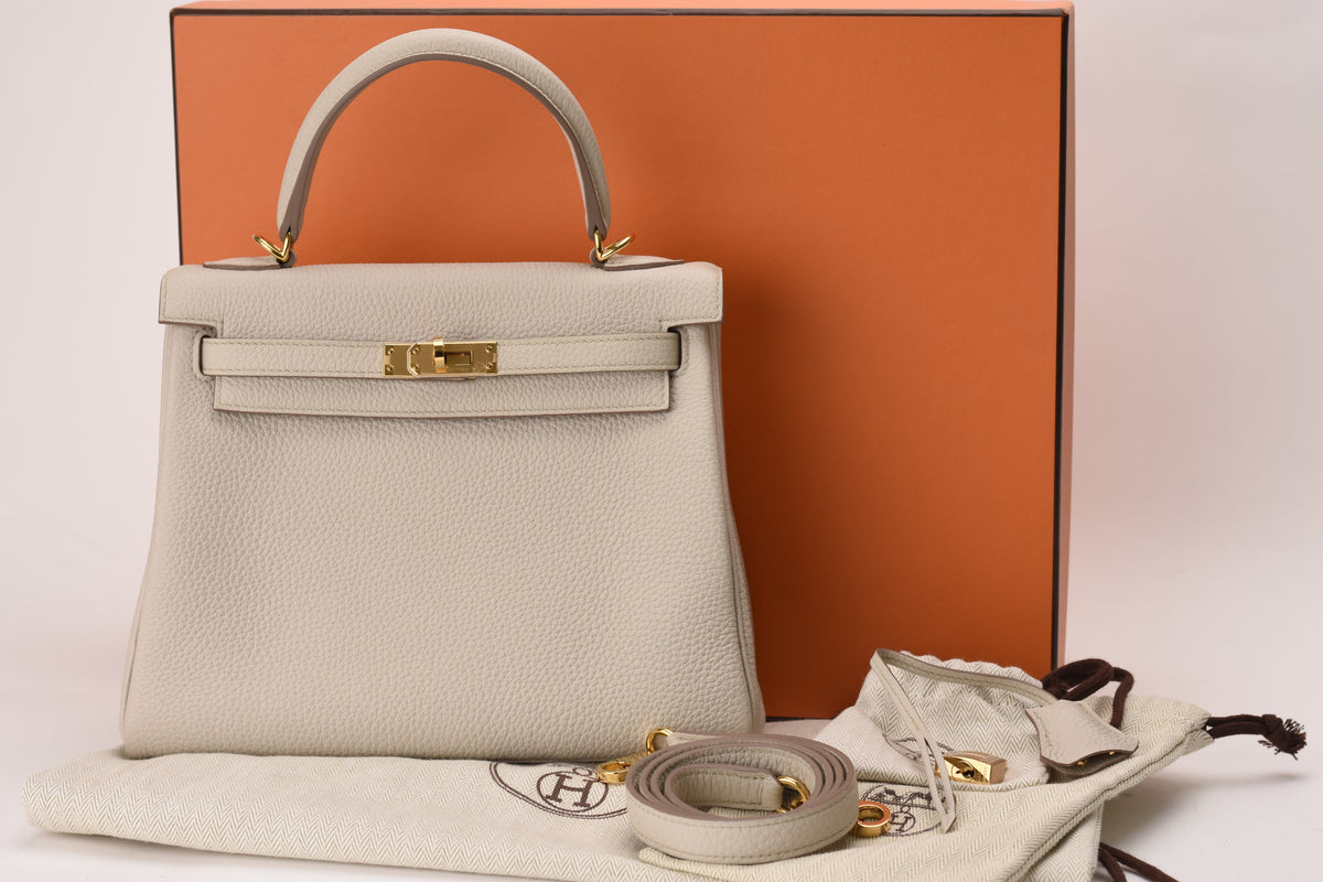 Hermès Kelly 25 Beton Retourne Togo leather handbag with gold hardware. curated Pre-loved Luxury by Myluxe in Helsinki.