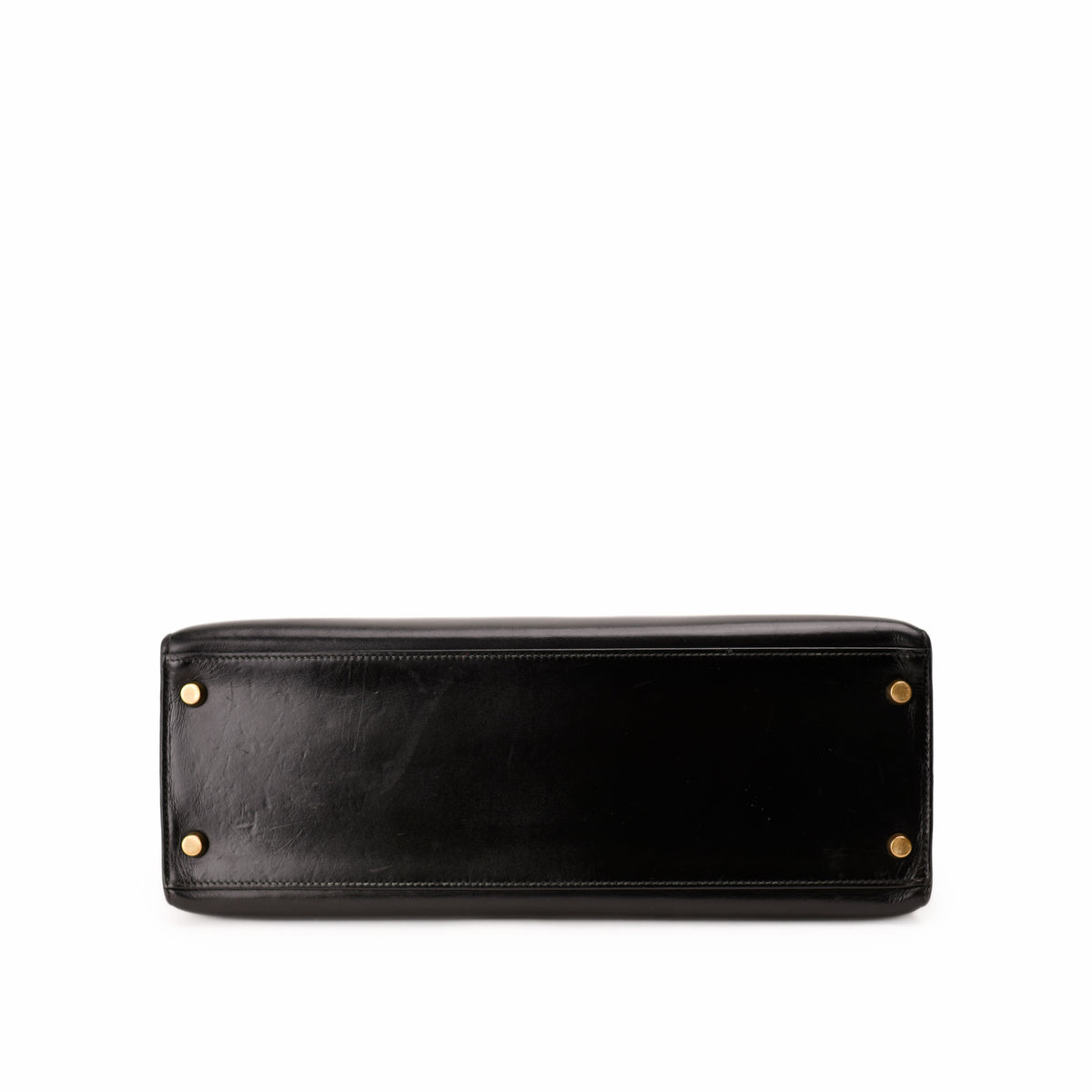 Black leather luxury handbag base with gold-tone metal feet. Curated Pre-loved Luxury by Myluxe in Helsinki.