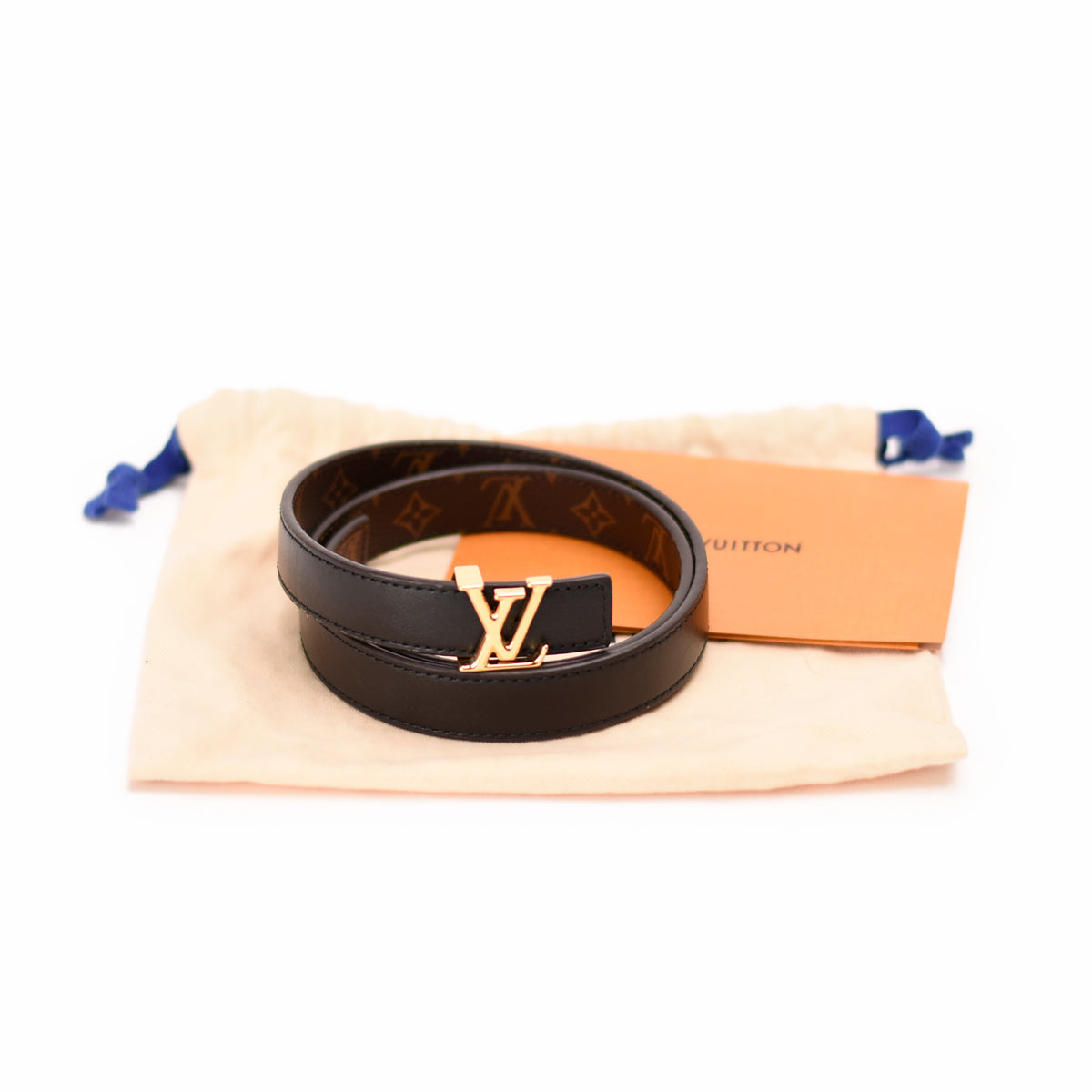 Black leather Louis Vuitton belt with gold LV buckle and monogram pattern, curated Pre-loved Luxury by Myluxe in Helsinki.