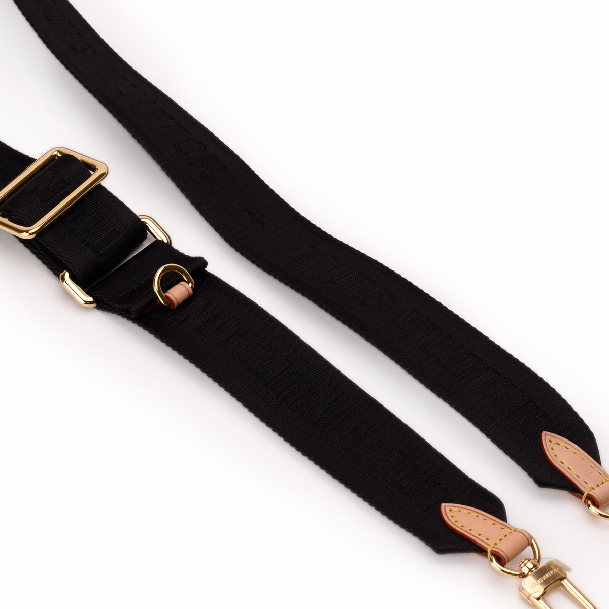 Black woven fabric strap with gold-tone metal hardware and tan leather accents. curated Pre-loved Luxury by Myluxe in Helsinki.