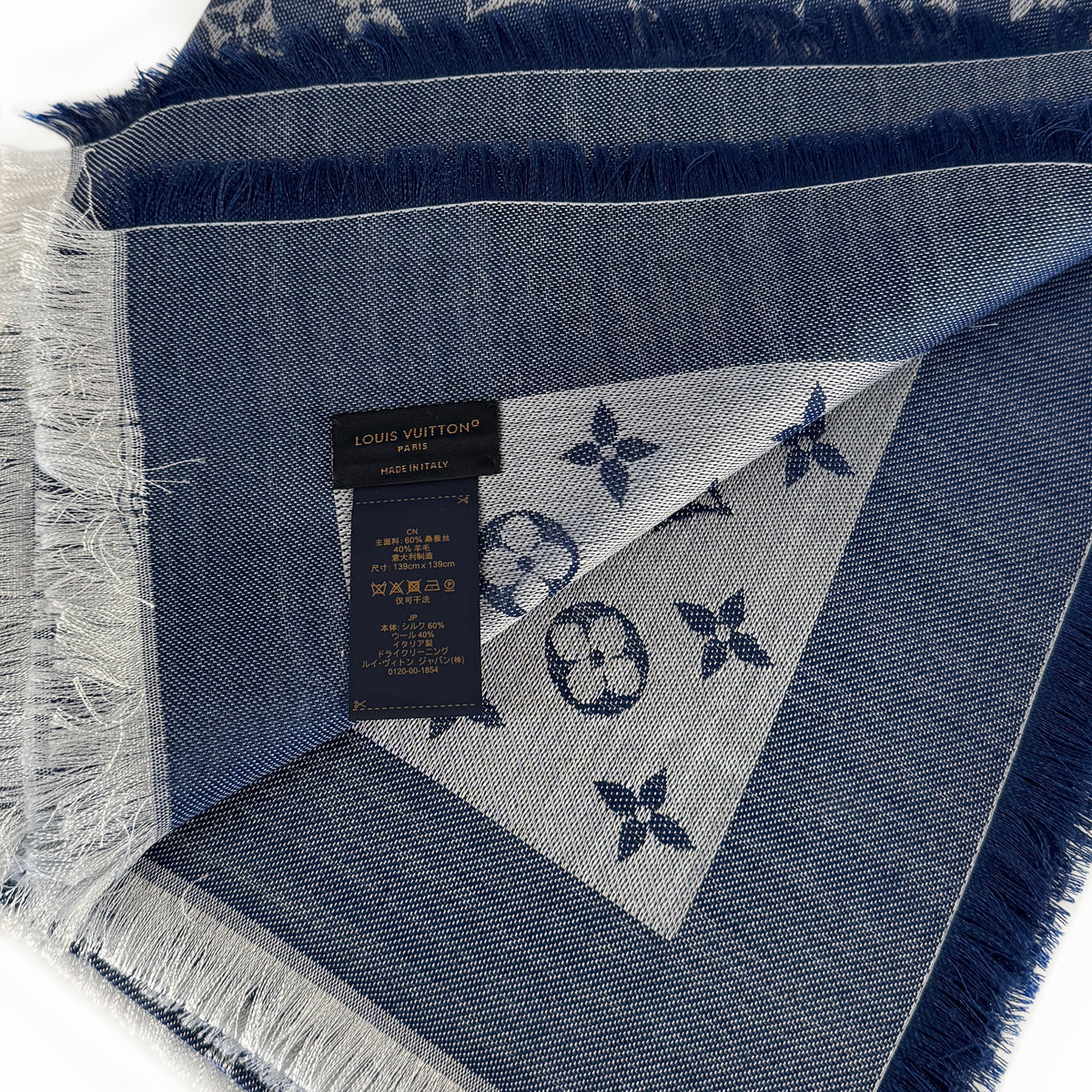 Blue denim Louis Vuitton monogram scarf with white fringe, curated Pre-loved Luxury by Myluxe in Helsinki.
