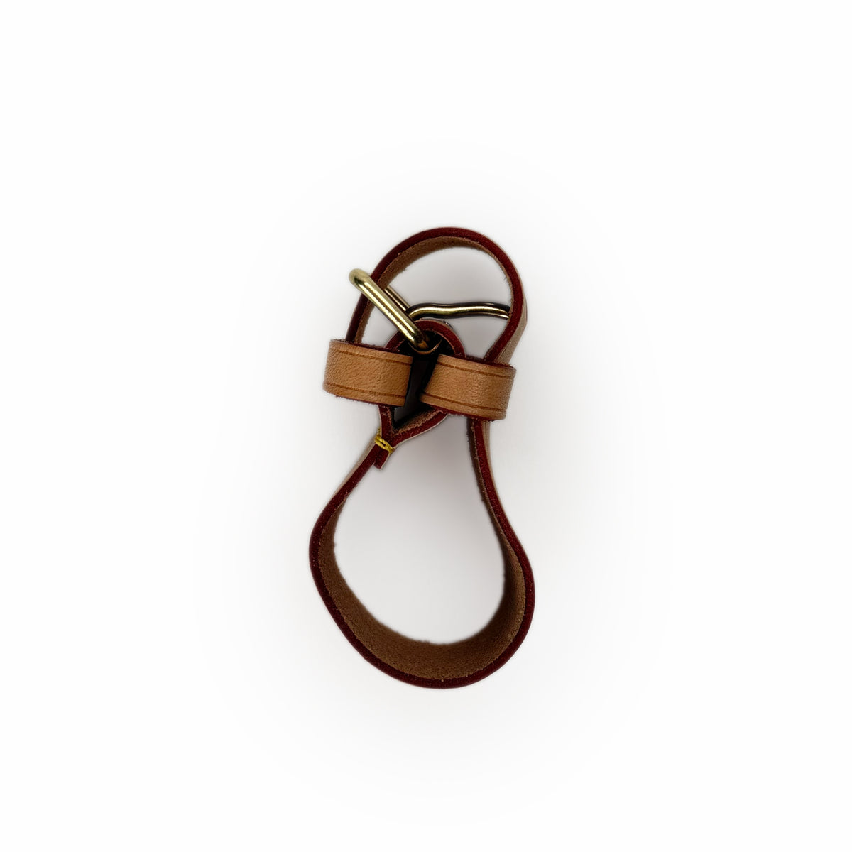 Burgundy and tan leather bag strap with gold-tone hardware, curated Pre-loved Luxury by Myluxe in Helsinki.