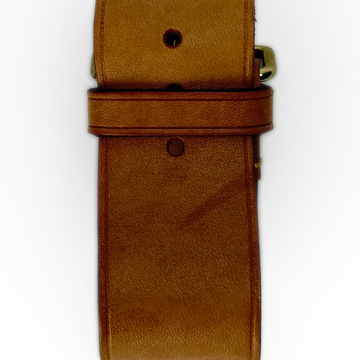 Close-up of a brown leather strap with gold-tone hardware, curated Pre-loved Luxury by Myluxe in Helsinki.