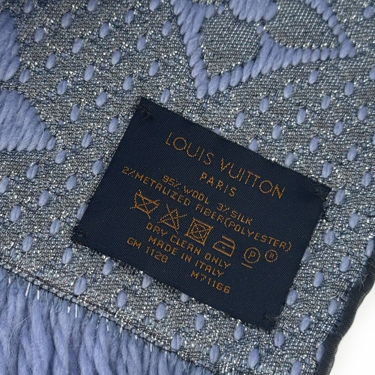Louis Vuitton Paris label on grey blue wool and silk metallic fabric, curated Pre-loved Luxury by Myluxe in Helsinki.