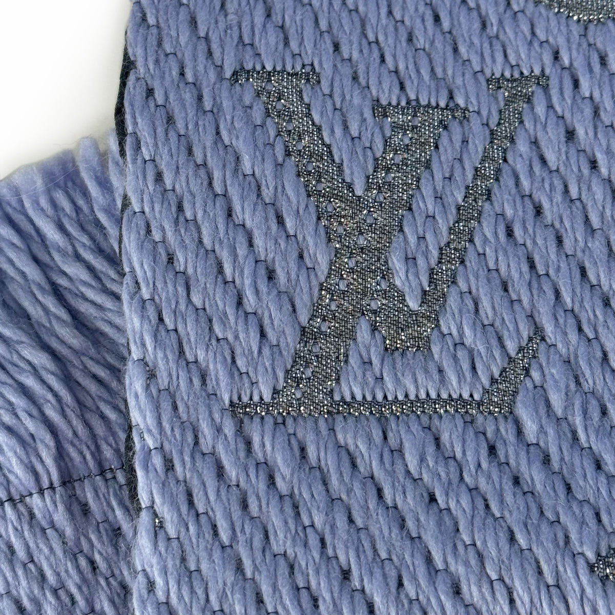 Blue knitted Louis Vuitton monogram texture, curated Pre-loved Luxury by Myluxe in Helsinki.
