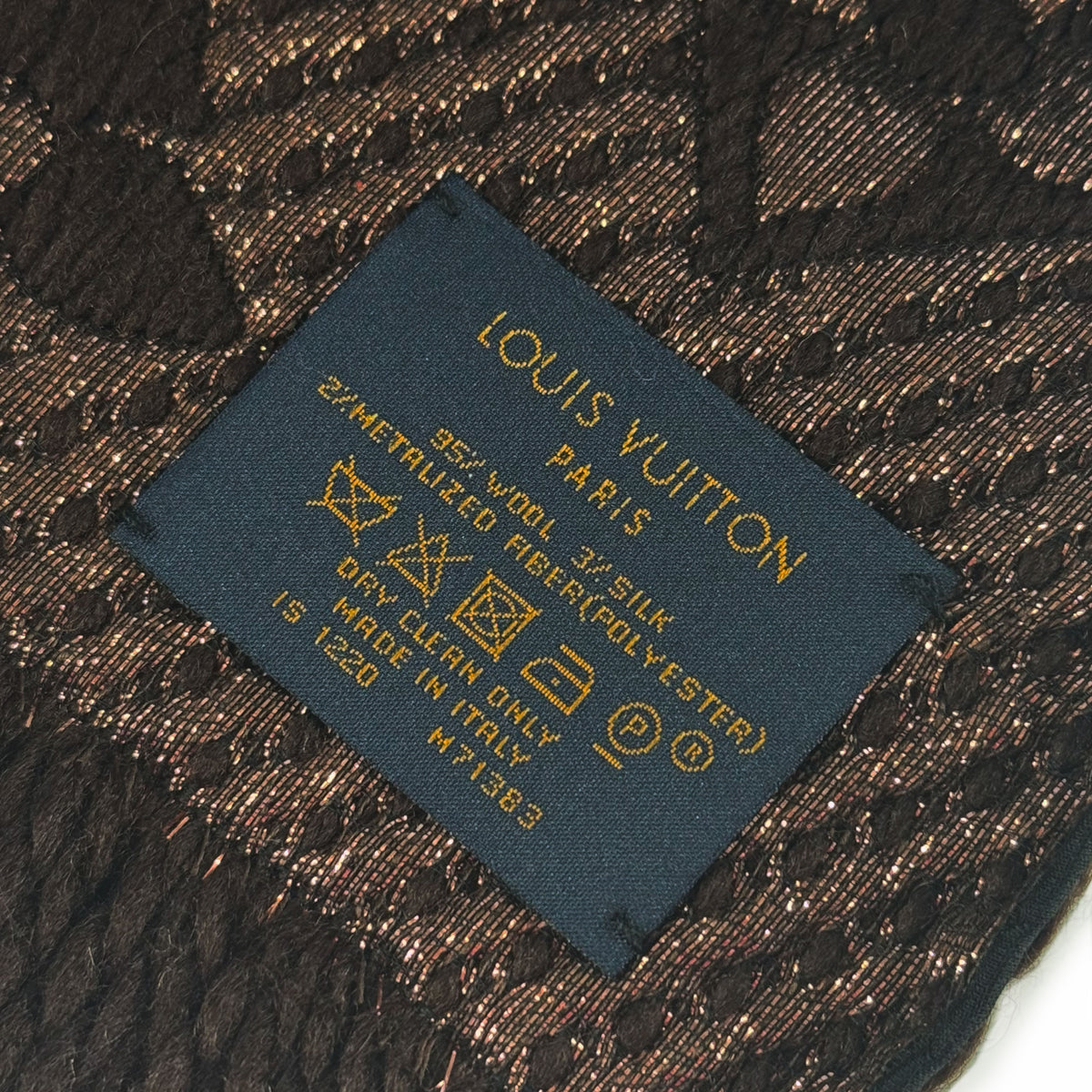 Louis Vuitton Paris care label on brown wool and silk patterned fabric, curated Pre-loved Luxury by Myluxe in Helsinki.