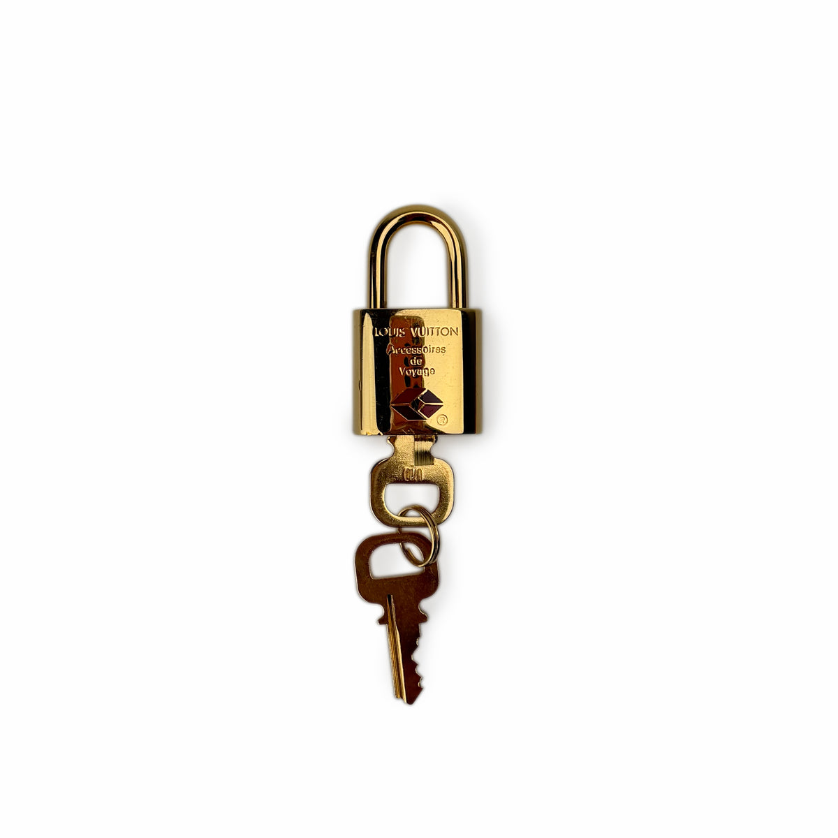 Gold-tone Louis Vuitton padlock and key, curated Pre-loved Luxury by Myluxe in Helsinki.