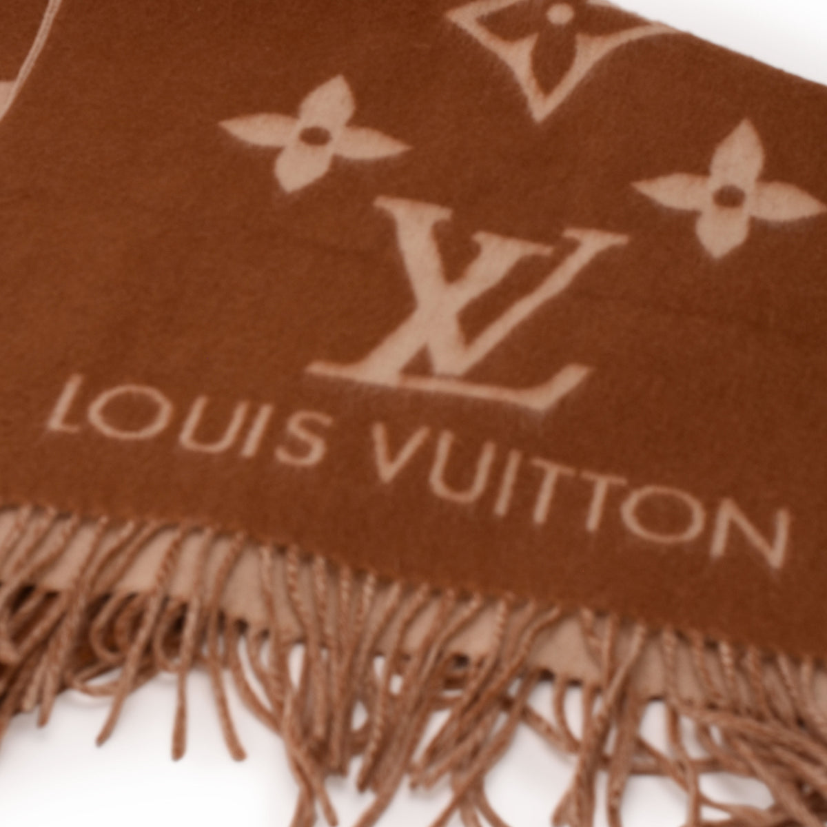 Brown Louis Vuitton monogram pattern wool scarf with fringe, curated Pre-loved Luxury by Myluxe in Helsinki.