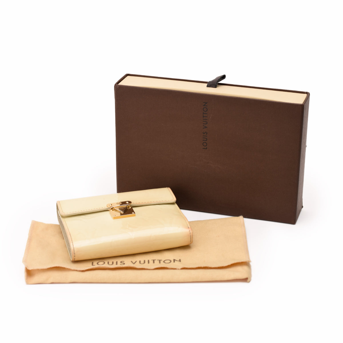 Cream Louis Vuitton leather wallet with gold clasp and matching dust bag, curated Pre-loved Luxury by Myluxe in Helsinki.