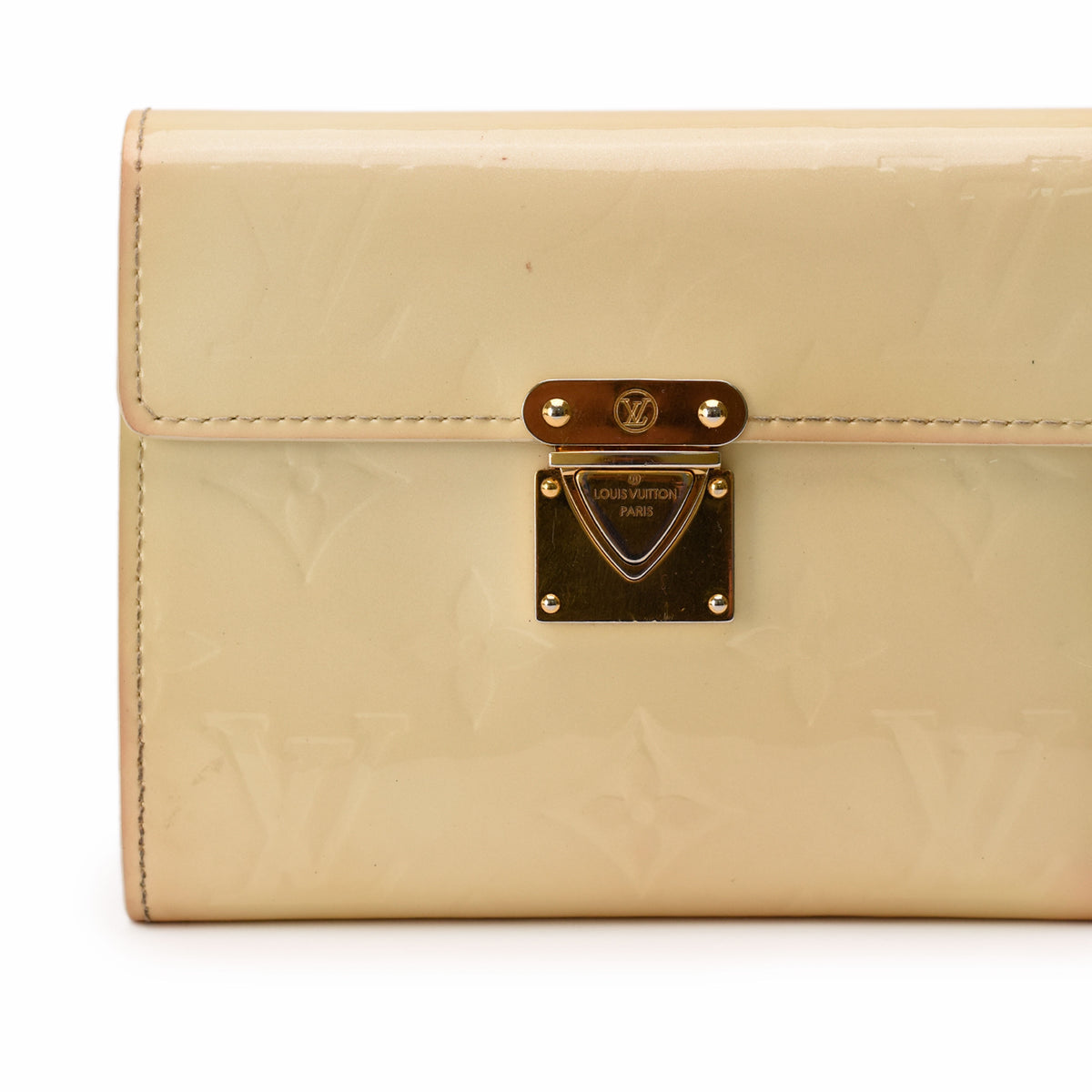 Cream patent leather Louis Vuitton clutch with gold-tone hardware, curated Pre-loved Luxury by Myluxe in Helsinki.