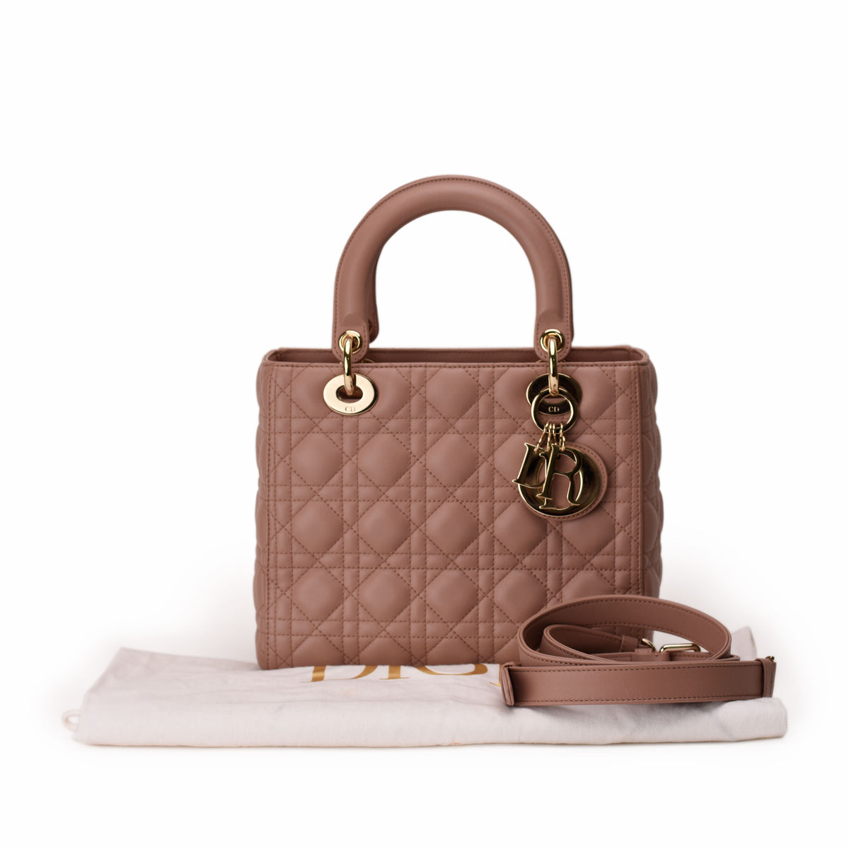 Dusty pink quilted leather Dior handbag with gold-tone hardware, curated Pre-loved Luxury by Myluxe in Helsinki.