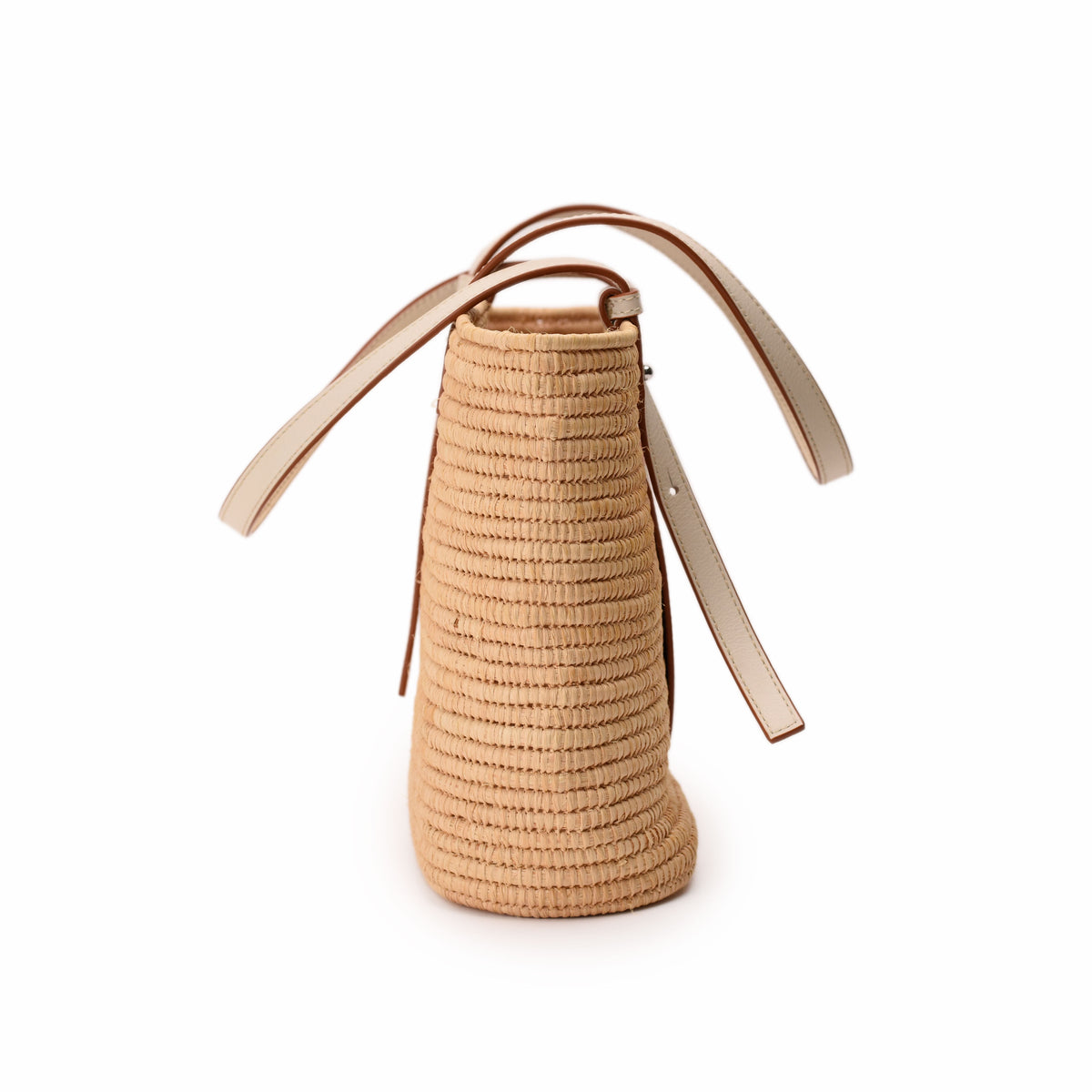 Beige woven straw bucket bag with cream leather handles, curated Pre-loved Luxury by Myluxe in Helsinki.