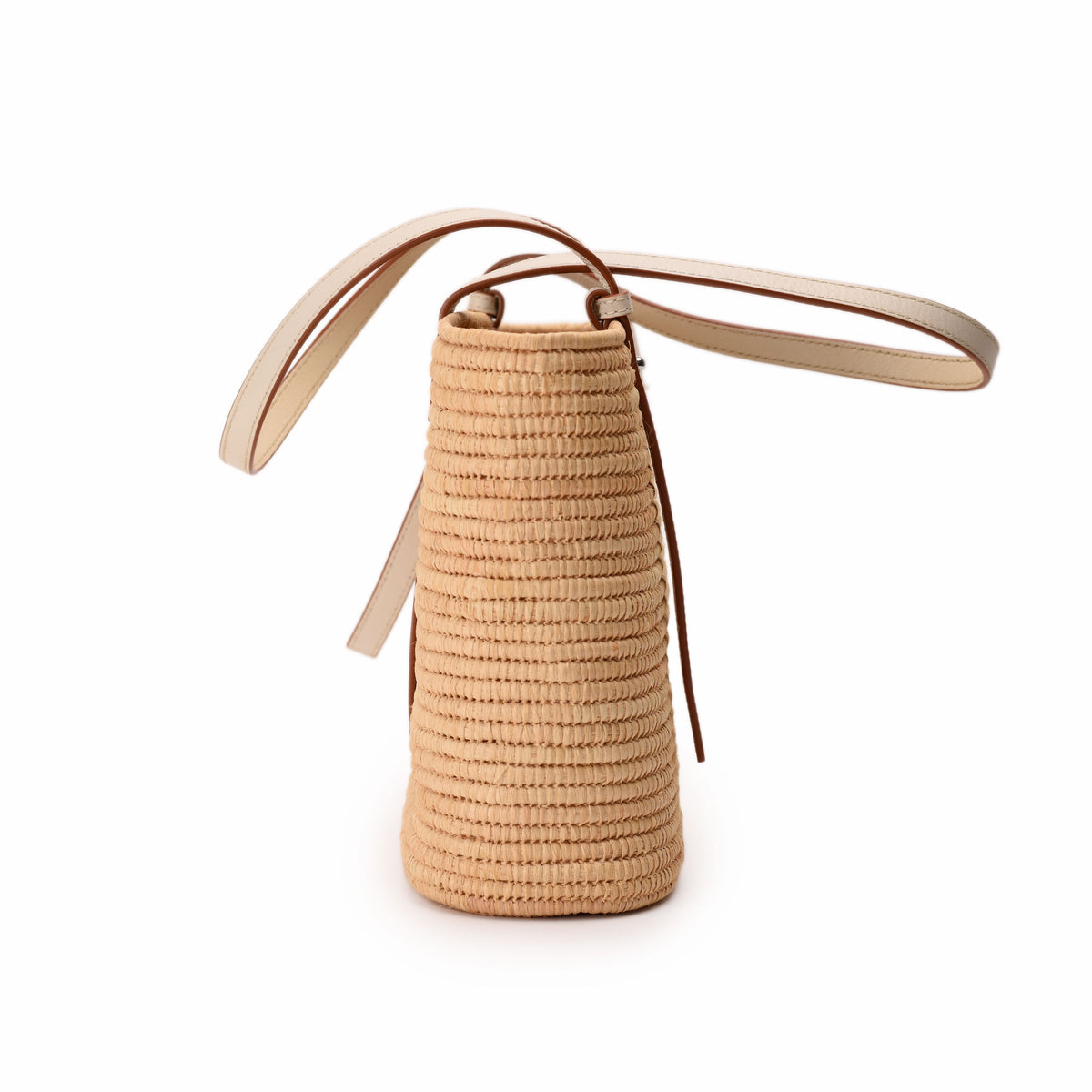Beige woven straw bucket bag with cream leather straps, curated Pre-loved Luxury by Myluxe in Helsinki.