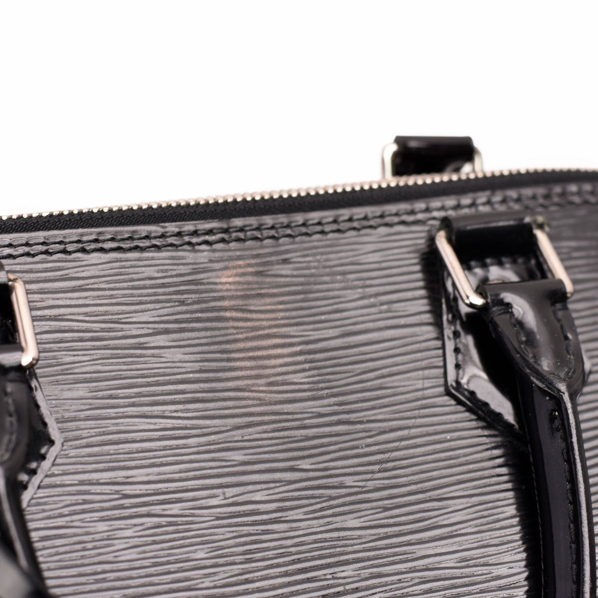 Black textured patent leather designer handbag with silver hardware, curated Pre-loved Luxury by Myluxe in Helsinki.