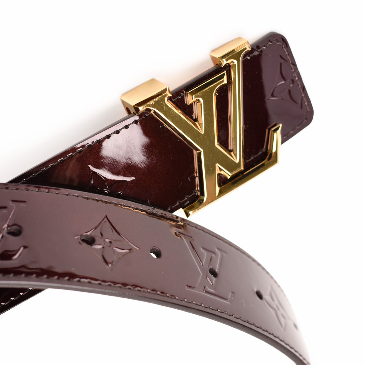 Louis Vuitton dark burgundy patent leather belt with gold-tone LV buckle, curated Pre-loved Luxury by Myluxe in Helsinki.
