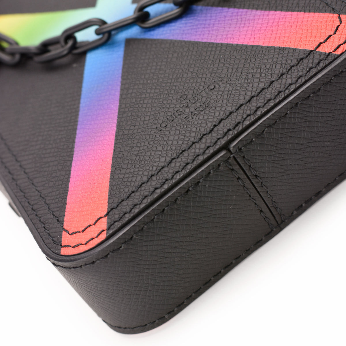 Louis Vuitton black textured leather bag with rainbow gradient stripes and black chain, curated Pre-loved Luxury by Myluxe in Helsinki.