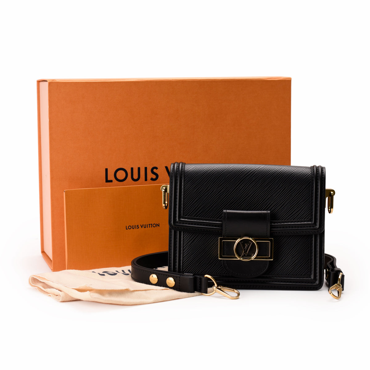 Black Louis Vuitton textured leather crossbody bag with gold hardware, curated Pre-loved Luxury by Myluxe in Helsinki.