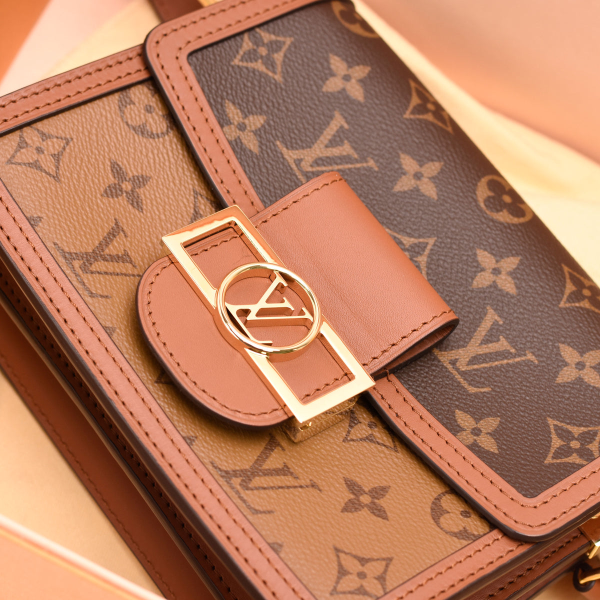 Louis Vuitton monogram canvas crossbody bag in brown leather with gold-tone hardware, curated Pre-loved Luxury by Myluxe in Helsinki.