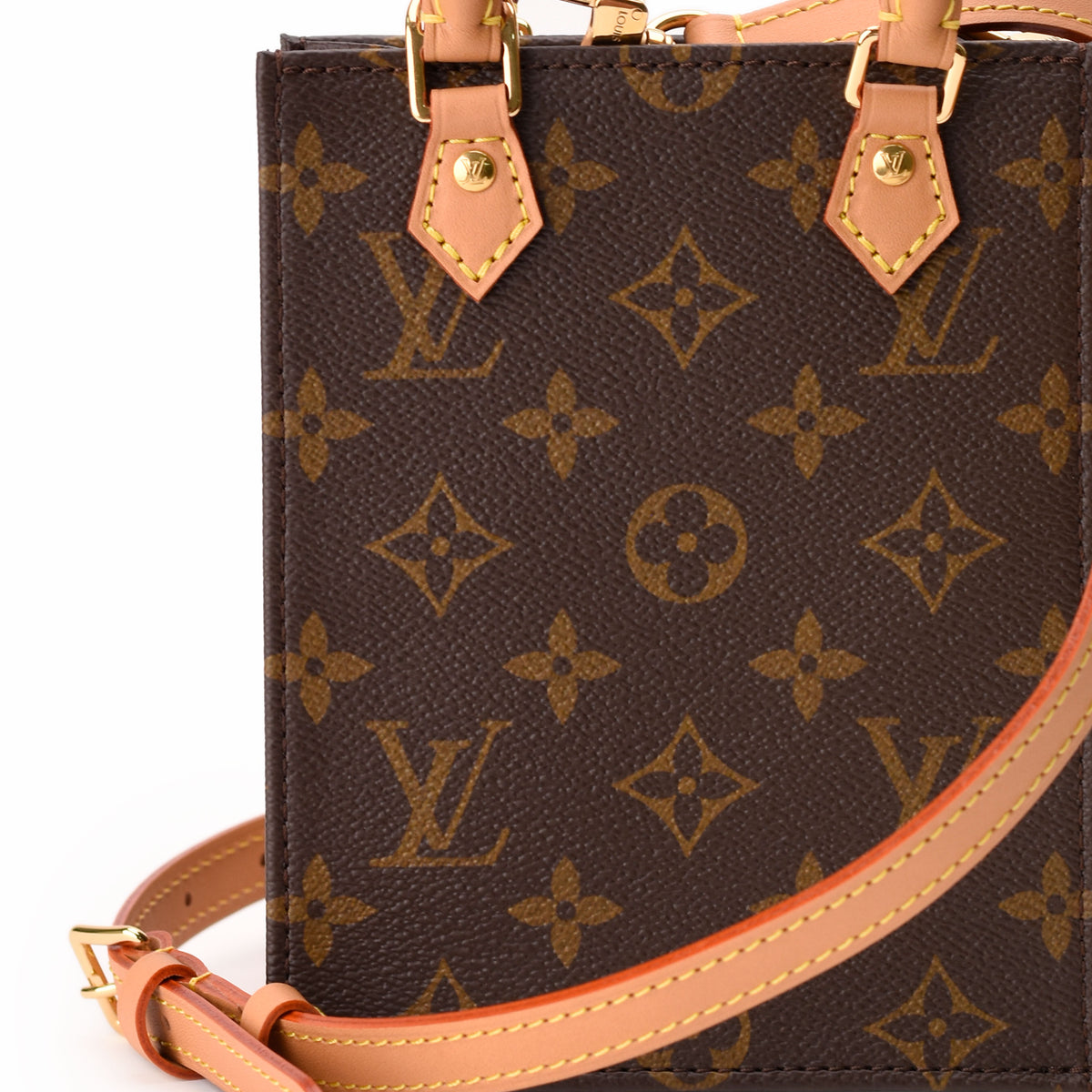 Louis Vuitton monogram canvas crossbody bag in brown with tan leather strap. curated Pre-loved Luxury by Myluxe in Helsinki.