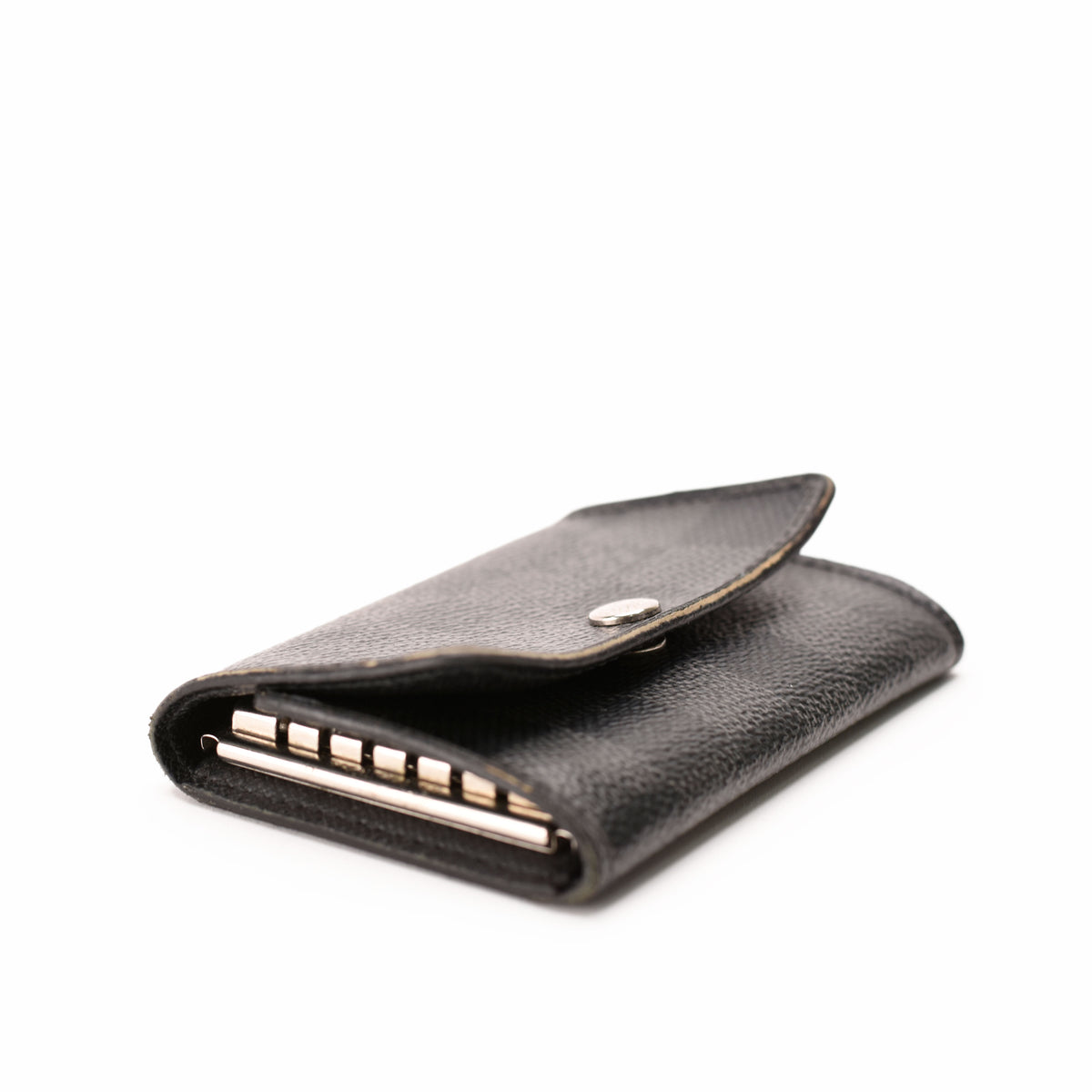 Black grained leather card holder with silver metal accents, curated Pre-loved Luxury by Myluxe in Helsinki.
