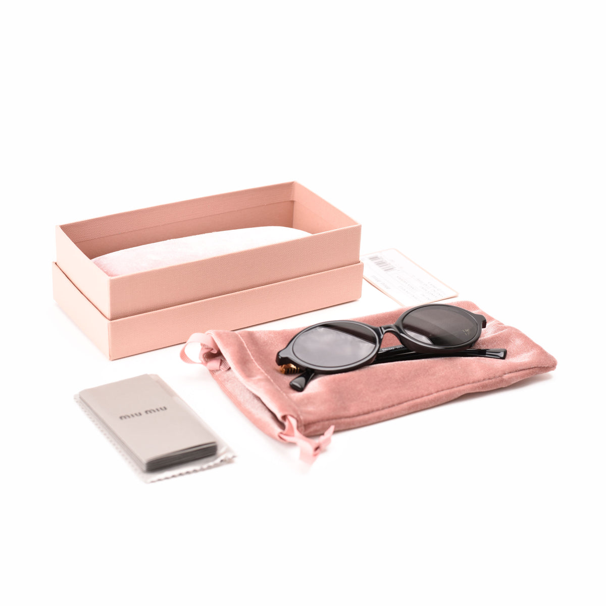 Miu Miu black round sunglasses with pink velvet pouch and box. curated Pre-loved Luxury by Myluxe in Helsinki.