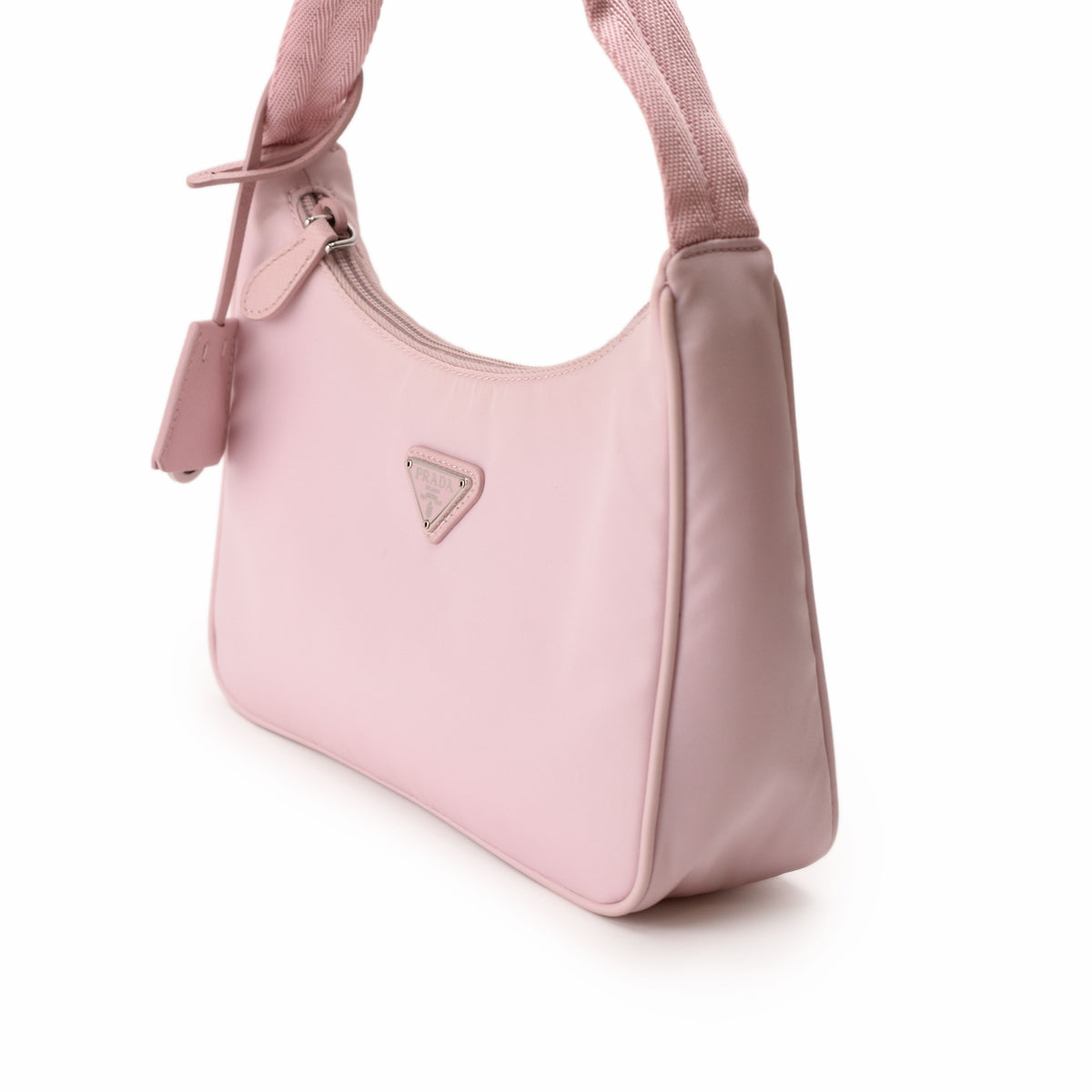 Pink Prada nylon shoulder bag with silver-tone logo. curated Pre-loved Luxury by Myluxe in Helsinki.