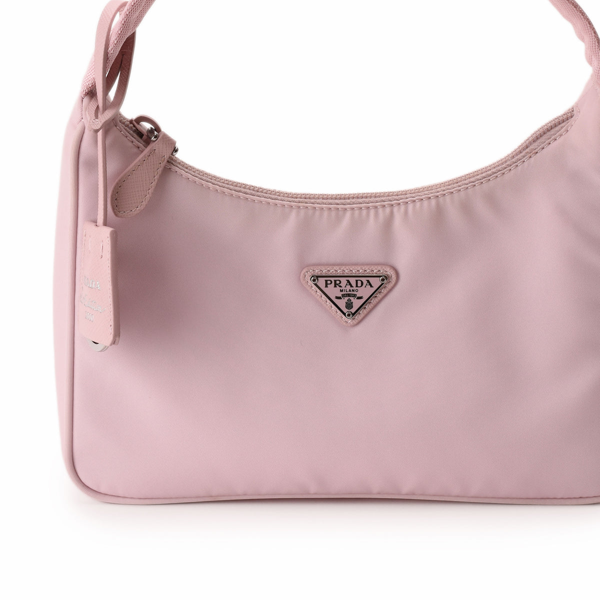 Prada pink nylon shoulder bag with silver triangle logo. curated Pre-loved Luxury by Myluxe in Helsinki.
