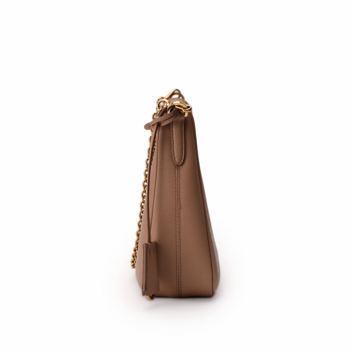Side view of a tan grained leather handbag with a gold chain strap, curated Pre-loved Luxury by Myluxe in Helsinki.
