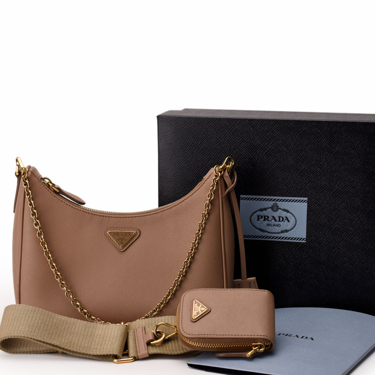 Beige Saffiano leather Prada shoulder bag with gold chain strap and matching coin purse, curated Pre-loved Luxury by Myluxe in Helsinki.